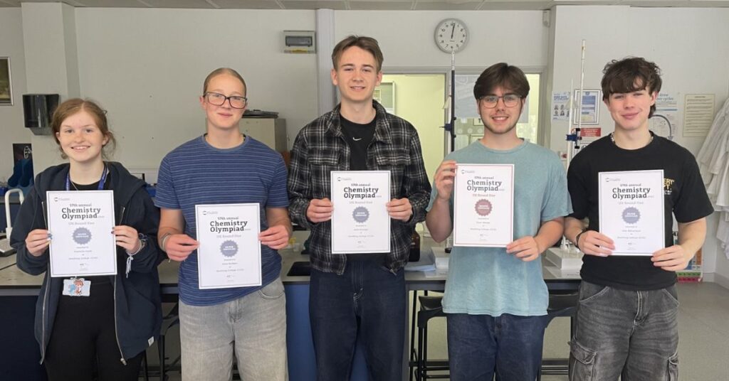 Our Worthing students stood recieving their certificates