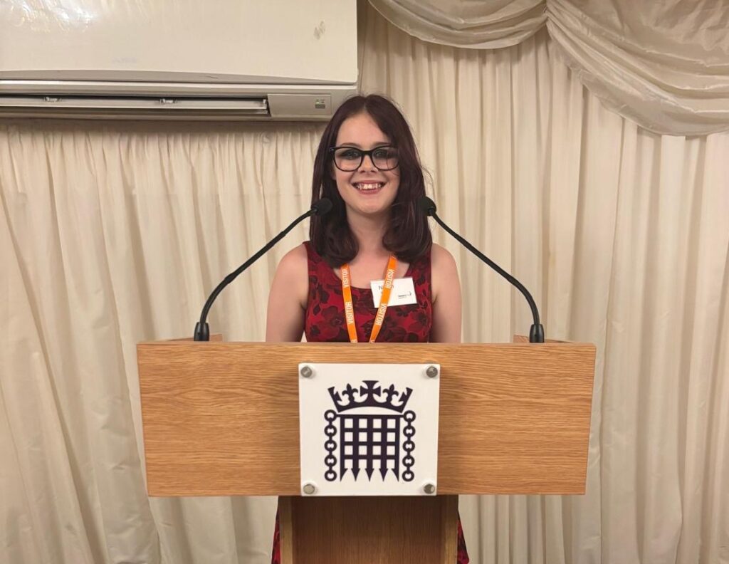 Worthing College student Niamh Bates talking to an audience at Parliament